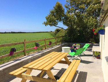 patio and seating looking towards open fields